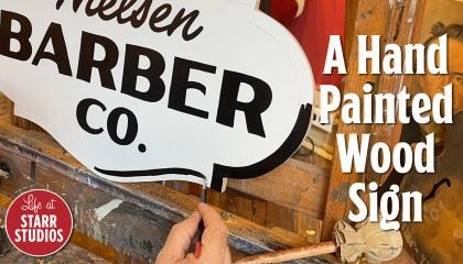 A Hand Painted Wood Sign for Nielsen Barber Co.